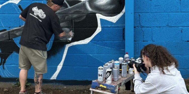 Watch road artists create beautiful motorsport mural to have a good time Adrian Flux Area legends